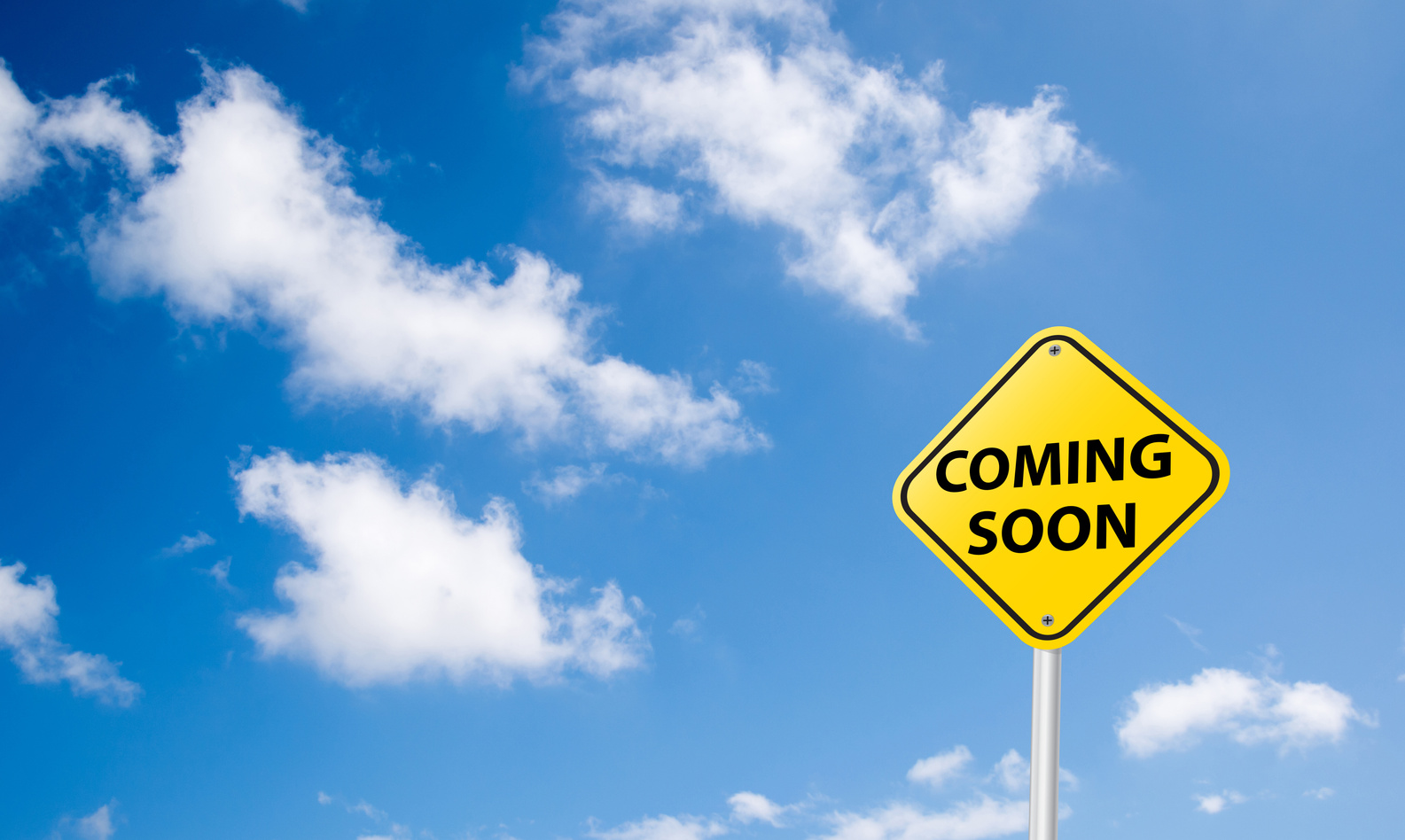 Coming Soon Sign ON BLUE SKY